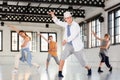 Group teenagers dancing hip-hop indoors Royalty Free Stock Photo