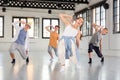 Group teenagers dancing hip-hop indoors Royalty Free Stock Photo