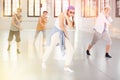 Group teenagers dancing hip-hop indoors Royalty Free Stock Photo