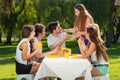 Group of teenagers enjoying a summer picnic