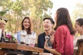 Group of 6 teenagers having fun together without liquor in cafe