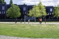 Group of teenagers playing outdoor volleyball at a city park