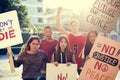 Group of teenagers protesting demonstration holding posters antiwar justice peace concept Royalty Free Stock Photo
