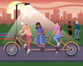 A group of teenagers ride a long bike in the park on a summer evening at sunset.