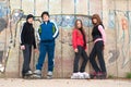 Group of teenagers in roller skates standing