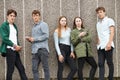 Group Of Teenagers Sharing Text Message On Mobile Phones Royalty Free Stock Photo