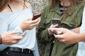Group Of Teenagers Sharing Text Message On Mobile Phones Royalty Free Stock Photo