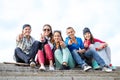 Group of teenagers showing finger five