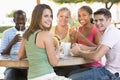 Group Of Teenagers Sitting Outdoors Royalty Free Stock Photo