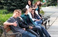 Group of teenagers sitting outside Royalty Free Stock Photo
