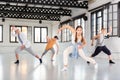 Teenagers training contemporary dance at studio