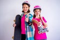 Teens with skateboards and rollerskates Royalty Free Stock Photo