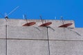 Group of telecommunications antennas on building terrace in Guatemala, Central America.