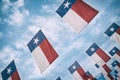 A group of Texas flags hanging against blue sky Royalty Free Stock Photo