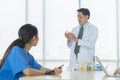 Group of Thai Asian doctors with medicine, medical team having a meeting, brainstorming conference call in hospital. Discussing Royalty Free Stock Photo