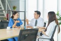 Group of Thai Asian doctors with medicine, medical team having a meeting, brainstorming conference call in hospital. Discussing Royalty Free Stock Photo