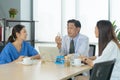 Group of Thai Asian doctors with medicine, medical team having a meeting, brainstorming conference call in hospital. Discussing Royalty Free Stock Photo