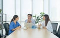 Group of Thai Asian doctors with medicine, medical team having a meeting, brainstorming conference call in hospital. Discussing Royalty Free Stock Photo