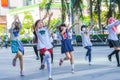 Group of Thai cosplayers dancing like cover girls for public show