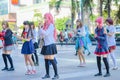 Group of Thai cosplayers dancing like cover girls for public show