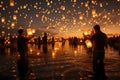 Group of Thai people release sky floating lanterns or lamp to worship Buddha\'s relics with reflection