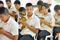 A group of Thai student in their school uniform is praying to th