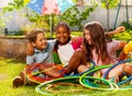 Kids portrait with hula hoops together on grass Royalty Free Stock Photo