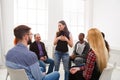 Therapist talking with a group at therapy session Royalty Free Stock Photo