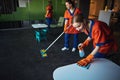 Janitorial workforce in uniforms tidying up the cafe Royalty Free Stock Photo