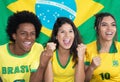 Group of three cheering brazilian soccer fans Royalty Free Stock Photo