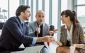 Group three formal businesspeople doing workshop, meeting, sitting and discussing together with relaxation in indoor modern office Royalty Free Stock Photo