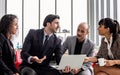 Group three formal businesspeople doing workshop, meeting, sitting and discussing together with relaxation in indoor modern office Royalty Free Stock Photo