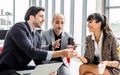 Group three formal businesspeople doing workshop, meeting, sitting and discussing together with relaxation in indoor modern office Royalty Free Stock Photo