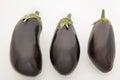 Group of three fresh aubergine