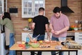 Group of three friends cooking Royalty Free Stock Photo