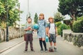 Group of three funny kids wearing backpacks walking back to school Royalty Free Stock Photo