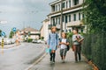 Group of three funny kids wearing backpacks walking back to school Royalty Free Stock Photo