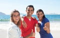 Group of three happy latin people at beach Royalty Free Stock Photo