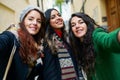 Group of three happy woman walking together outdoors