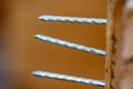 Group of three nails thru a crate close up Royalty Free Stock Photo