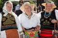 Group of three old Romanian women dressed in folk costumes Royalty Free Stock Photo