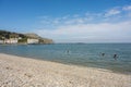 A group of three paddleboarders in Llandudno Bay, North Wales