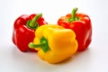 Group of three peppers on white background with one red and one yellow pepper. Generative AI Royalty Free Stock Photo