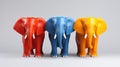 A group of three plastic elephants standing next to each other