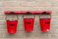 Three red fire buckets Royalty Free Stock Photo