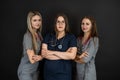 Group of three young female doctor or nurse wear uniform stethoscope isolated on black Royalty Free Stock Photo