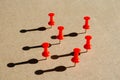 Group   of    thumbtack  on cardboard   used  for   concept regarding social distance or teamwork Royalty Free Stock Photo