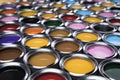 Group of tin metal cans with color paint Royalty Free Stock Photo