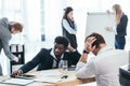 group of tired businesspeople in conference hall Royalty Free Stock Photo