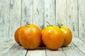Group of tomato on wooden plank